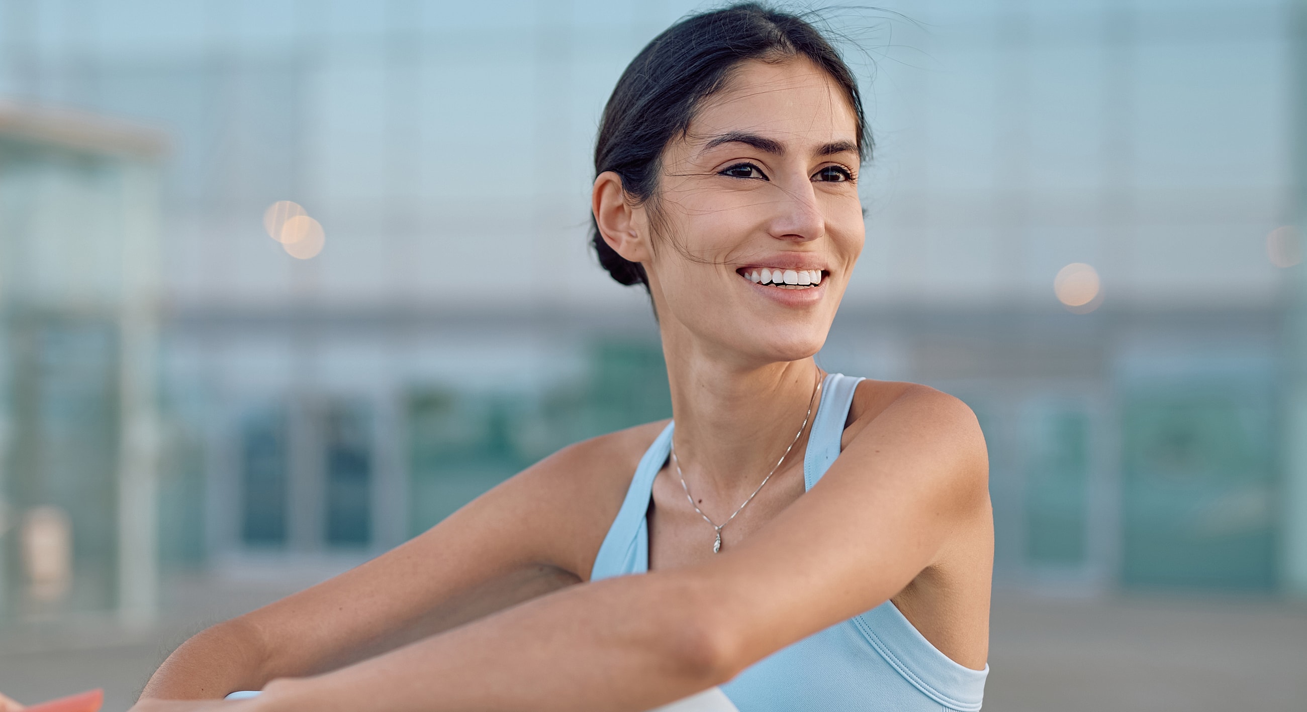 NYC Umbilical Hernia Repair woman in athletic wear outdoors.